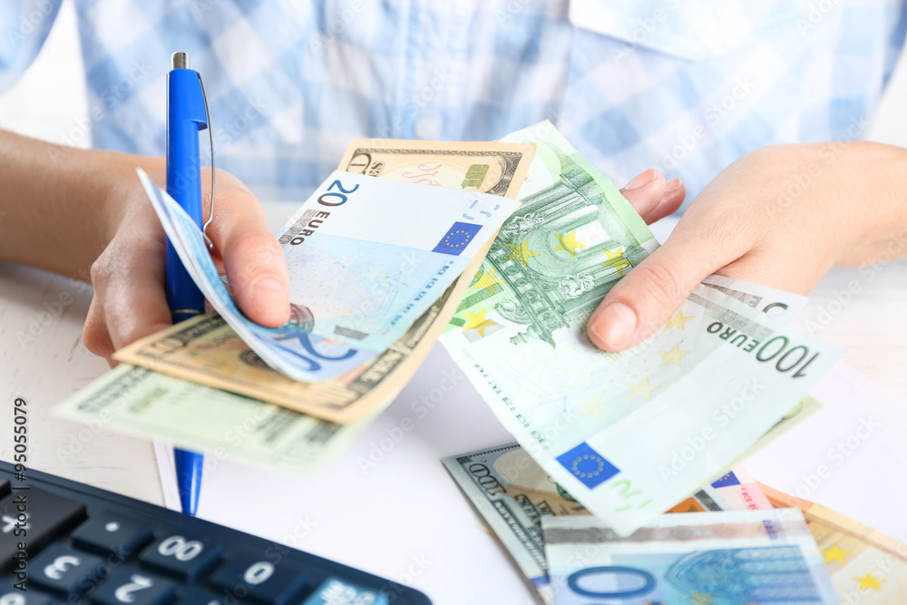Accounting concept.Analyzing finance report with calculator Accounting concept.Analyzing finance report with calculator