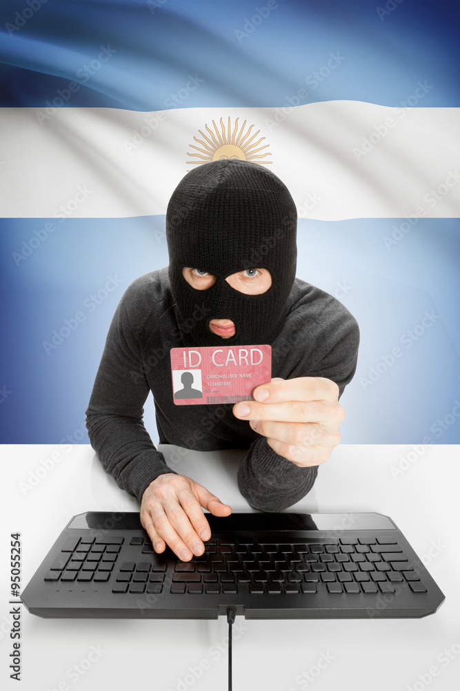 Hacker with flag on background holding ID card in hand - Argentina Hacker with flag on background holding ID card in hand - Argentina