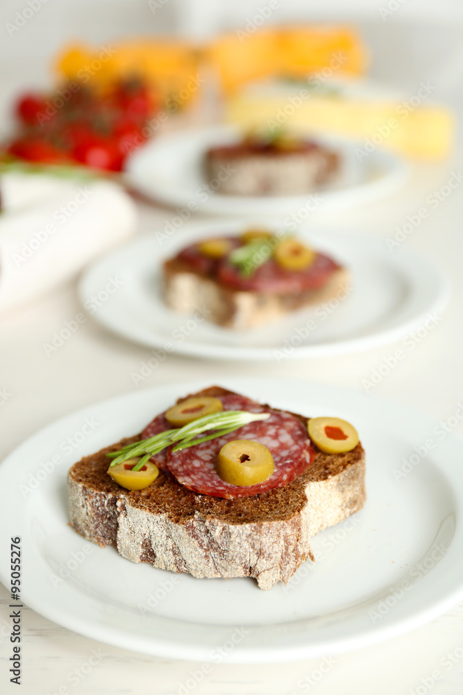 Tasty sandwiches on plates, close up