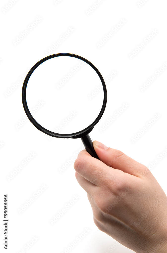 Hand holding magnifying glass isolated on white background Hand holding magnifying glass isolated on white background