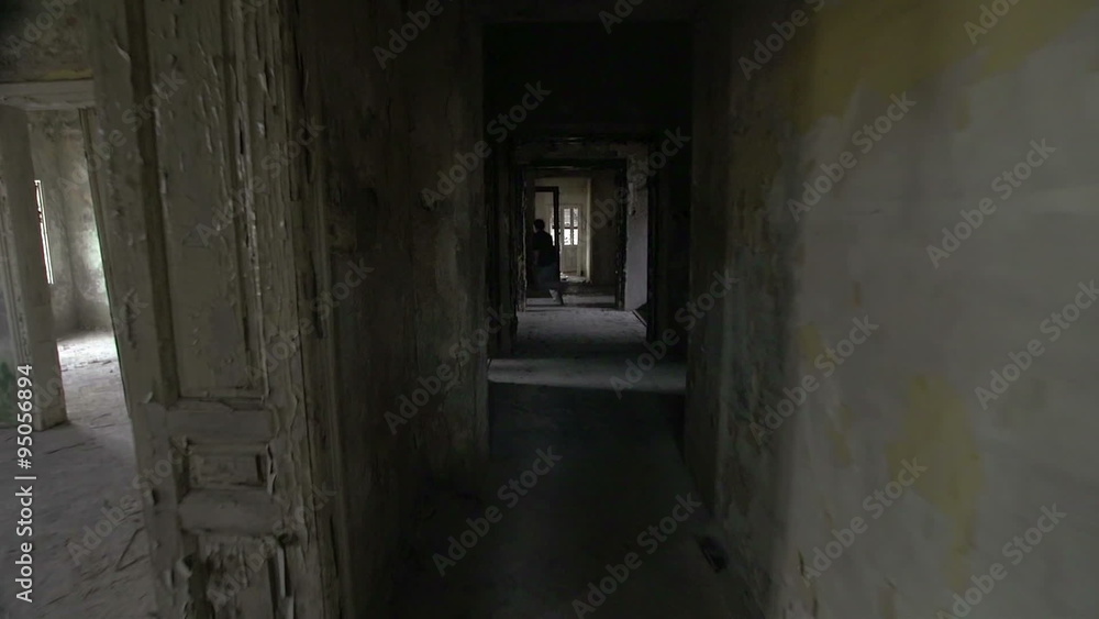 SLOW MOTION: Free runners running and jumping through abandoned house SLOW MOTION: Free runners running and jumping through abandoned house