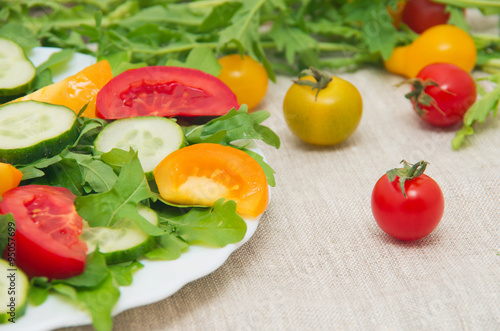 Fresh salad with tomatoes  rucola and cucumbers