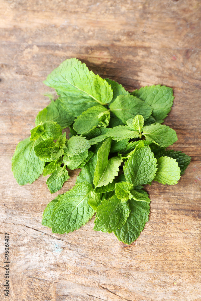 Bunch of mint on wooden background Bunch of mint on wooden background