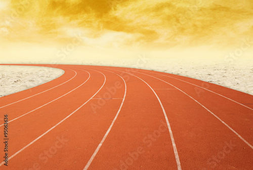 outdoor running track with desert at sunset