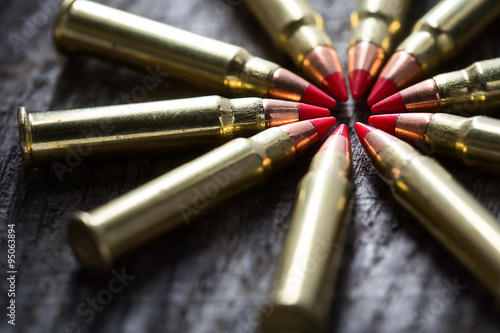 Macro shot of small-caliber tracer rounds with a red tip photo