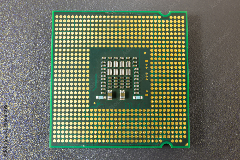 Computer CPU Chip on black surface background Computer CPU Chip on black surface background