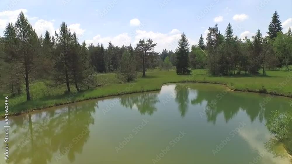 AERIAL: Flying over lake and river meanders running through nature AERIAL: Flying over lake and river meanders running through nature