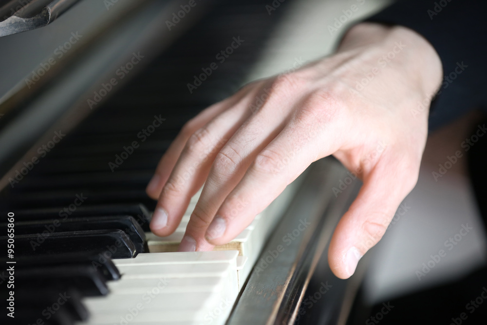 Obraz premium Close up of man hands piano playing