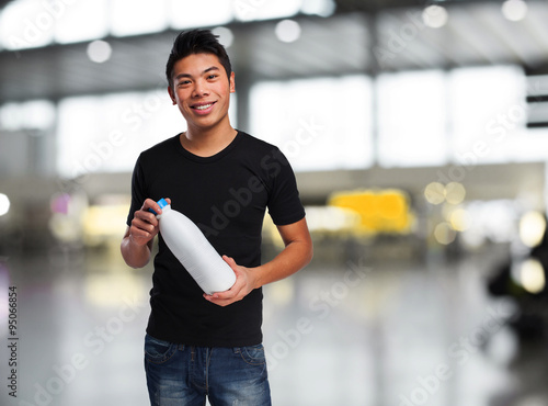 young chinese man drinking milk
