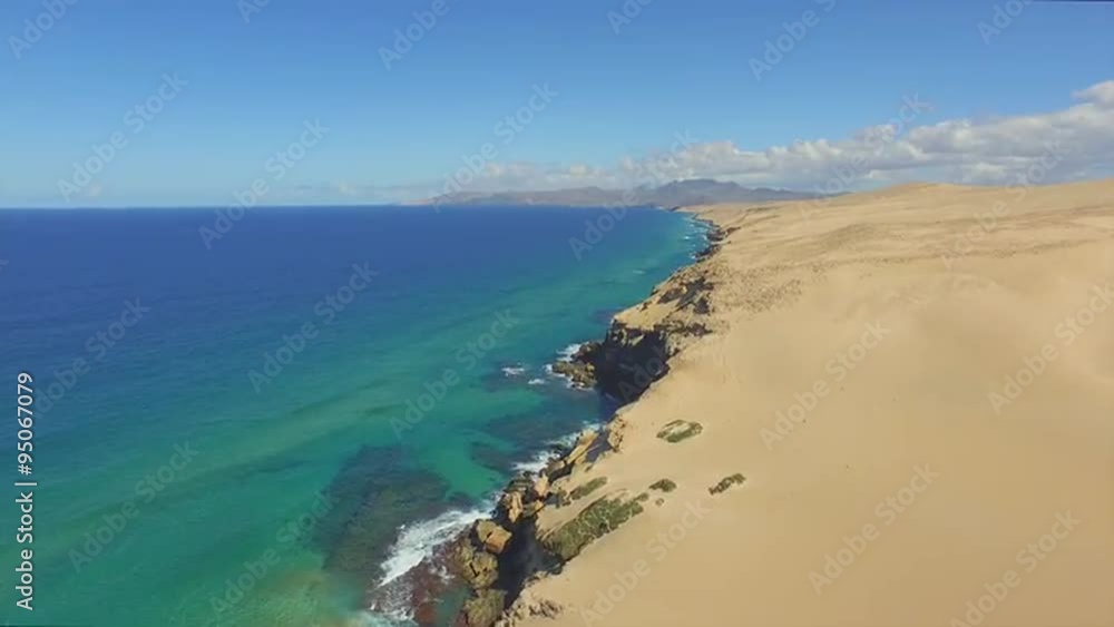 AERIAL: Sandy desert and Atlantic ocean joining in stunning beach AERIAL: Sandy desert and Atlantic ocean joining in stunning beach