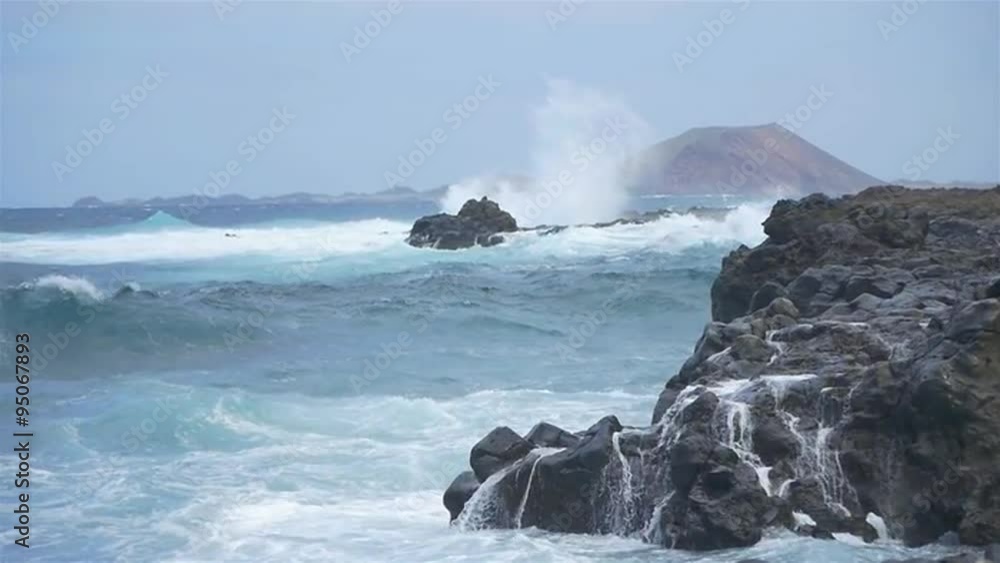 SLOW MOTION: Angry sea splashing into shore in windy summer SLOW MOTION: Angry sea splashing into shore in windy summer