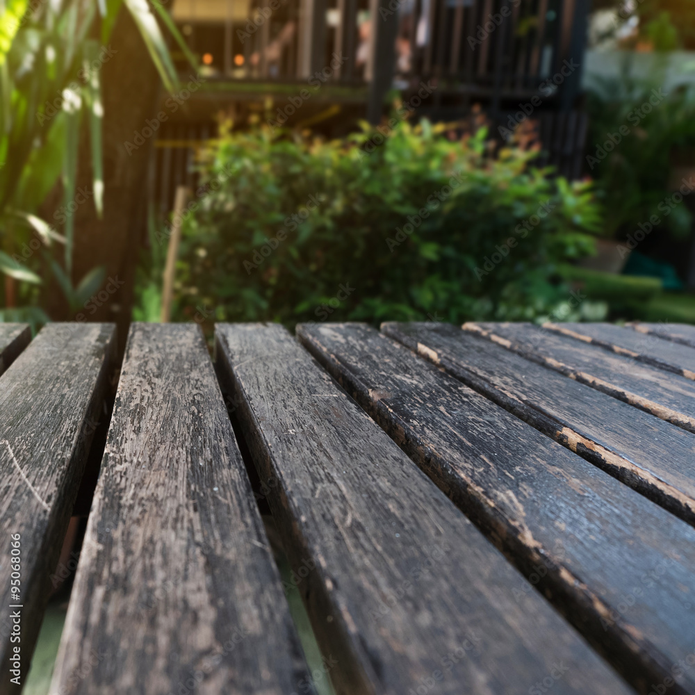 old table wood plank with green natural blurred background old table wood plank with green natural blurred background