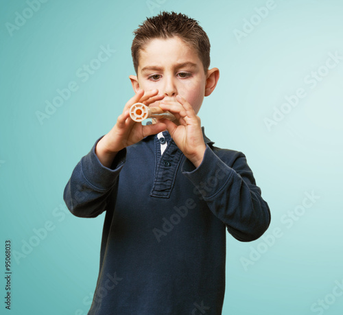 little kid playing flute photo