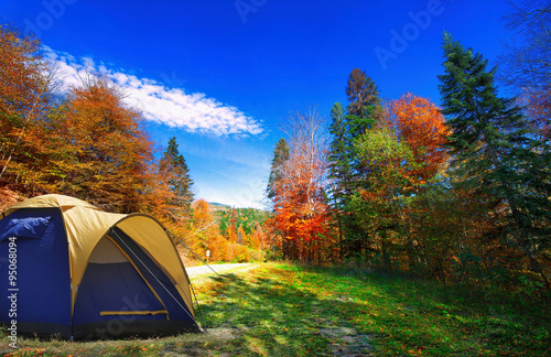 Tent in the autumn forest