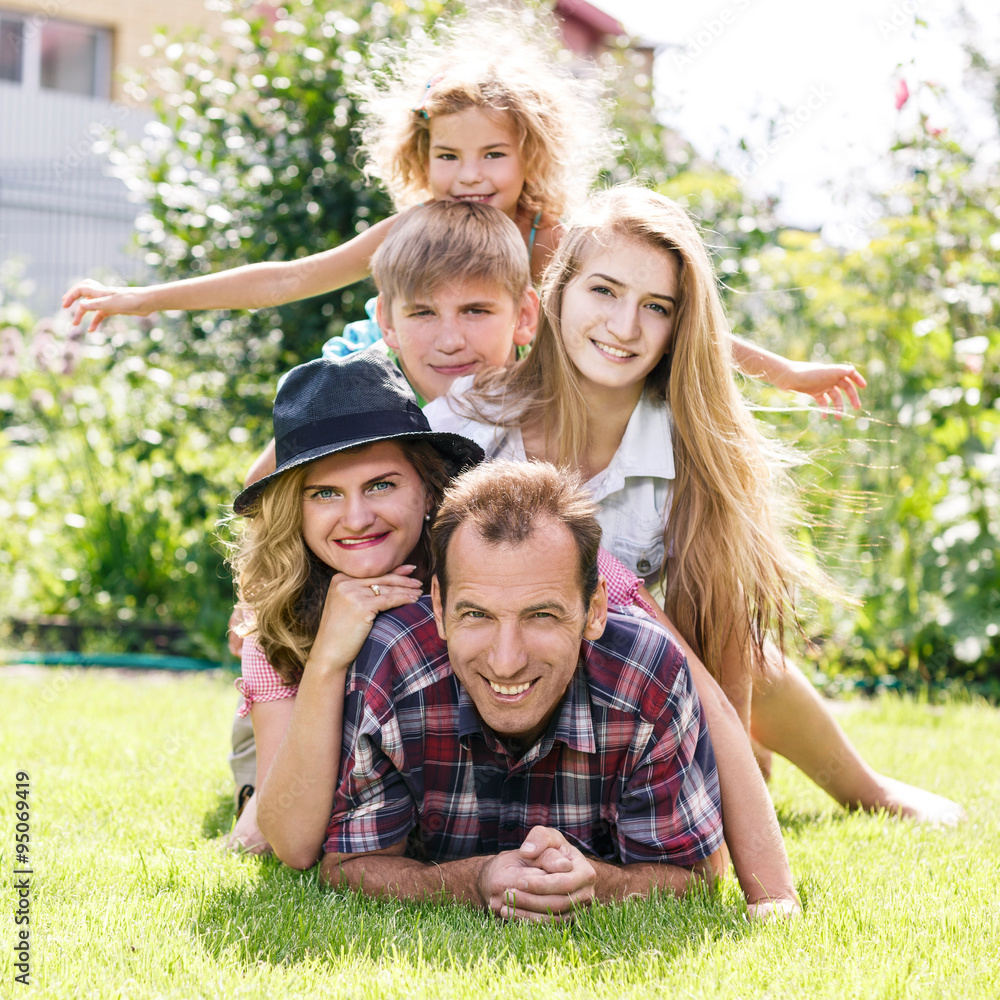 Happy family having weekend in summer park Happy family having weekend in summer park