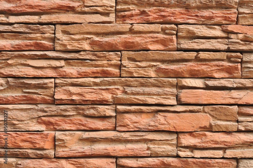 Wall made of layers of red slate. Wall made of layers of red slate.