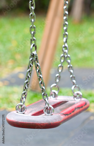 Swings in a children play area at park.