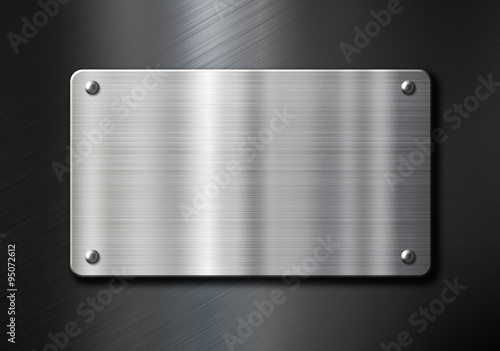 stainless steel metal plate over black background