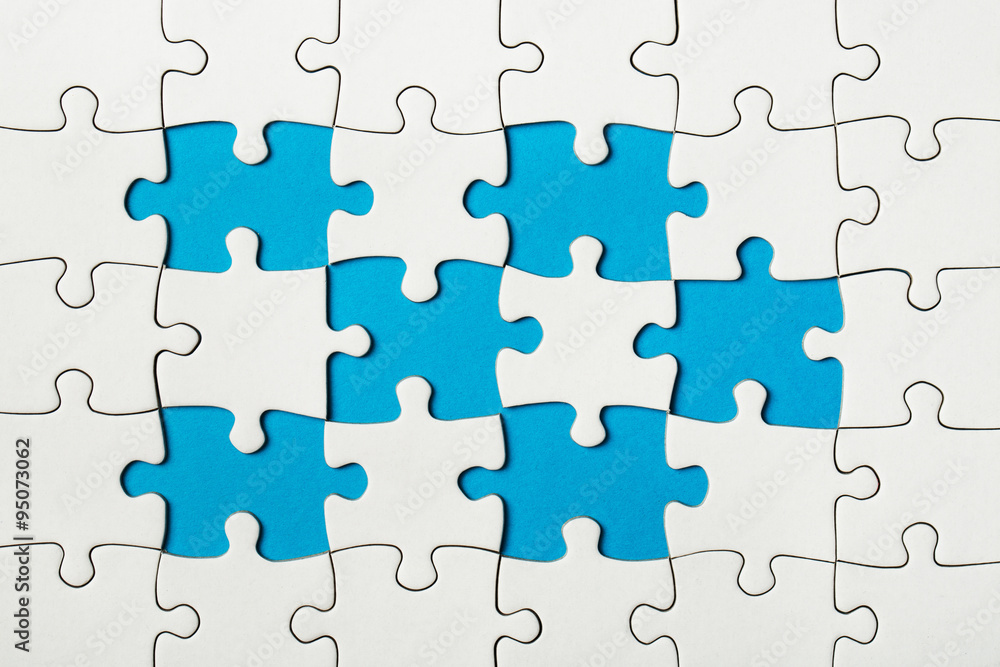 Missing puzzle pieces on blue background Missing puzzle pieces on blue background