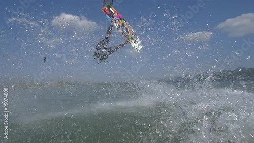 SLOW MOTION: Kitesurfer extreme jumping trick