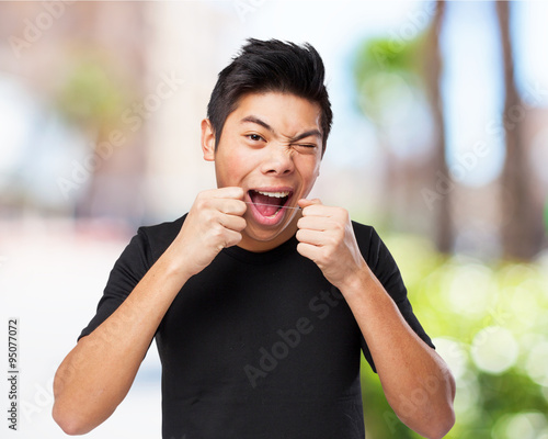 cool chinese man using dental flosh photo