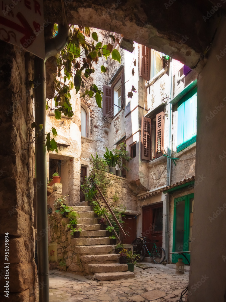 Fototapeta premium Narrow Street in Old Town of Rovinj, Istria, Croatia