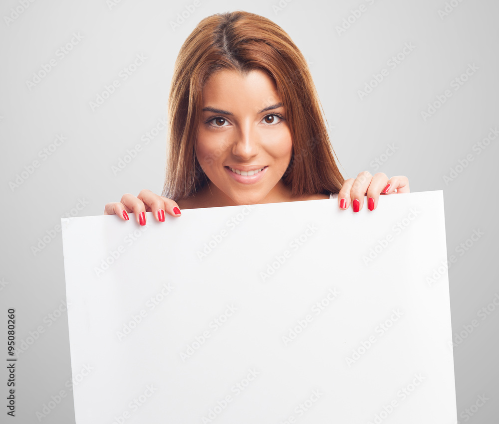 portrait of a beautiful young woman holding a white banner portrait of a beautiful young woman holding a white banner