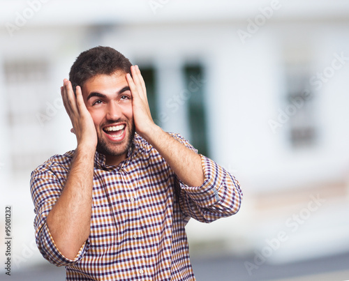 Принти на полотні portrait of a crazy man doing a mad gesture