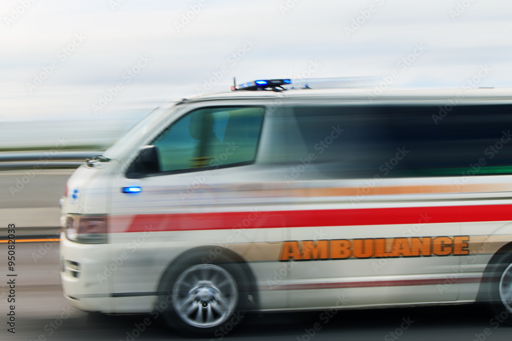 urgent ambulance moving fast to rescue life with motion blur