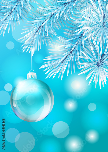 Glass Christmas ball on white tree backdrop