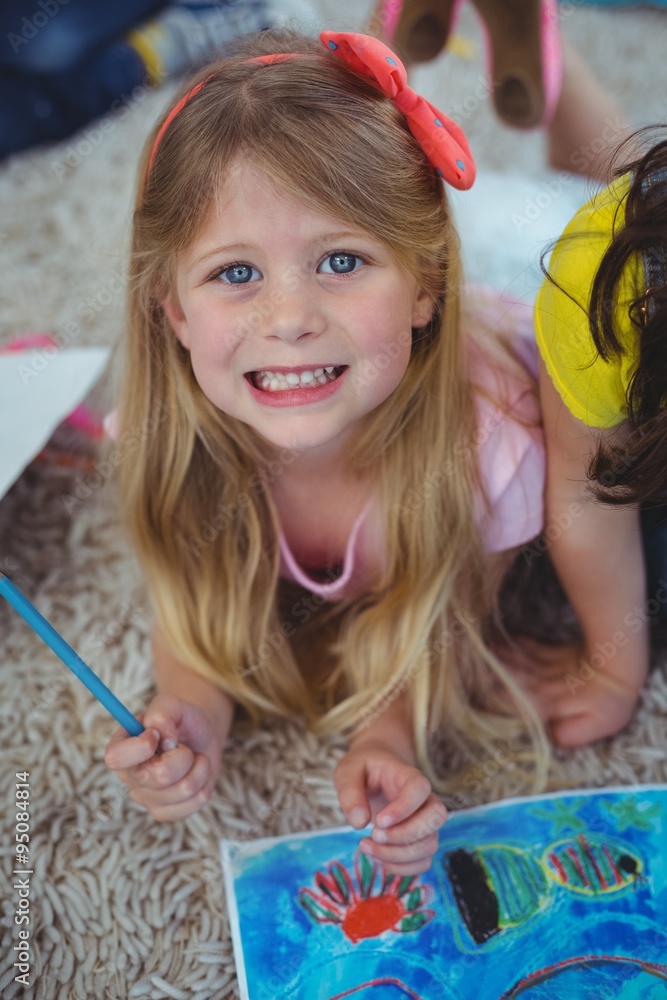 Smiling kid drawing pictures on paper Smiling kid drawing pictures on paper