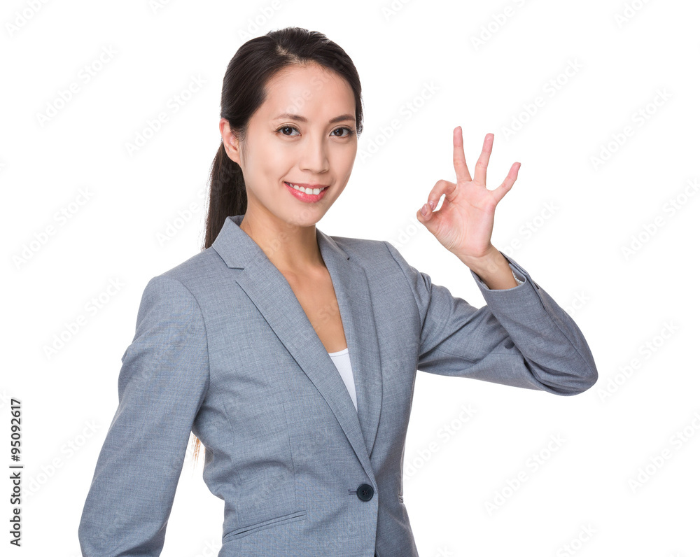 Asian Businesswoman showing ok sign gesture Asian Businesswoman showing ok sign gesture
