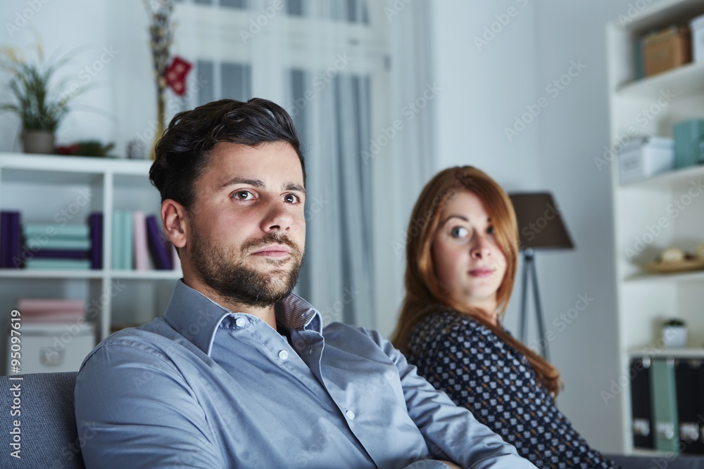 young modern couple is irritated of christmas young modern couple is irritated of christmas