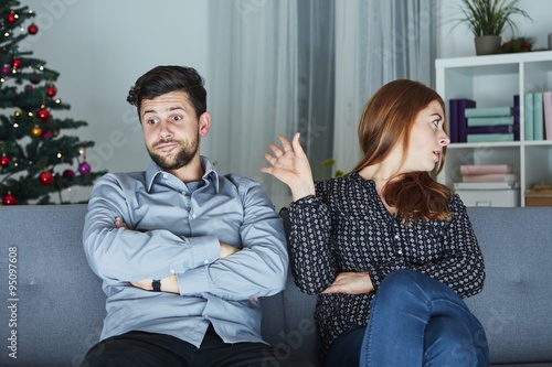 young modern couple is irritated of christmas