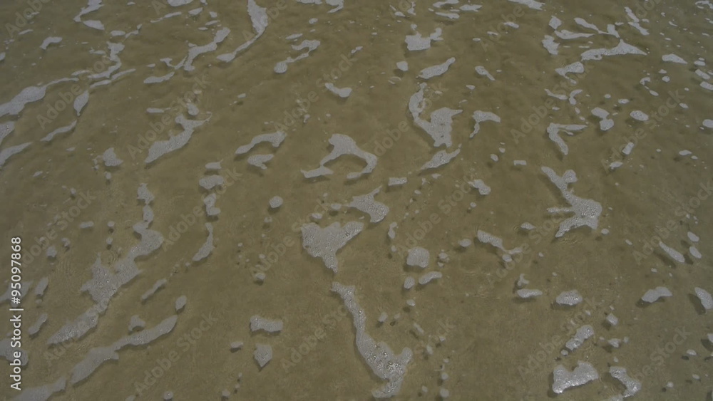 Waves on the sand beach