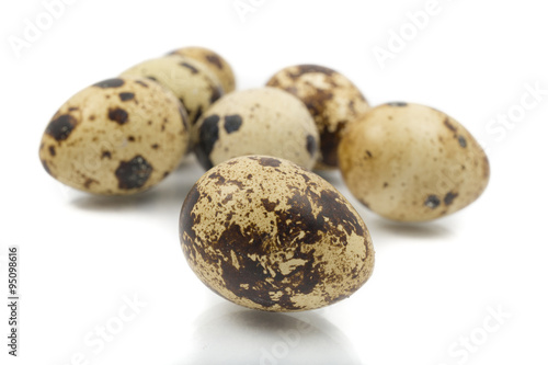 quail eggs close-up on a white background