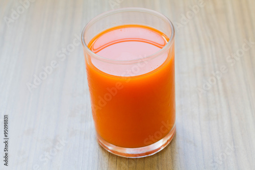 Healthy carrot juice cool drink on the wooden table