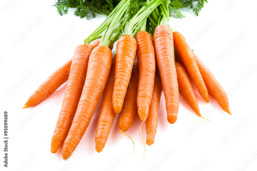 Bunch of fresh carrots with green tops. Isolated on a white. Bunch of fresh carrots with green tops. Isolated on a white.