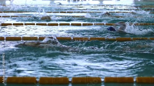 Teenage Competition in Swimming pool race in the tracks,indoor swim pool