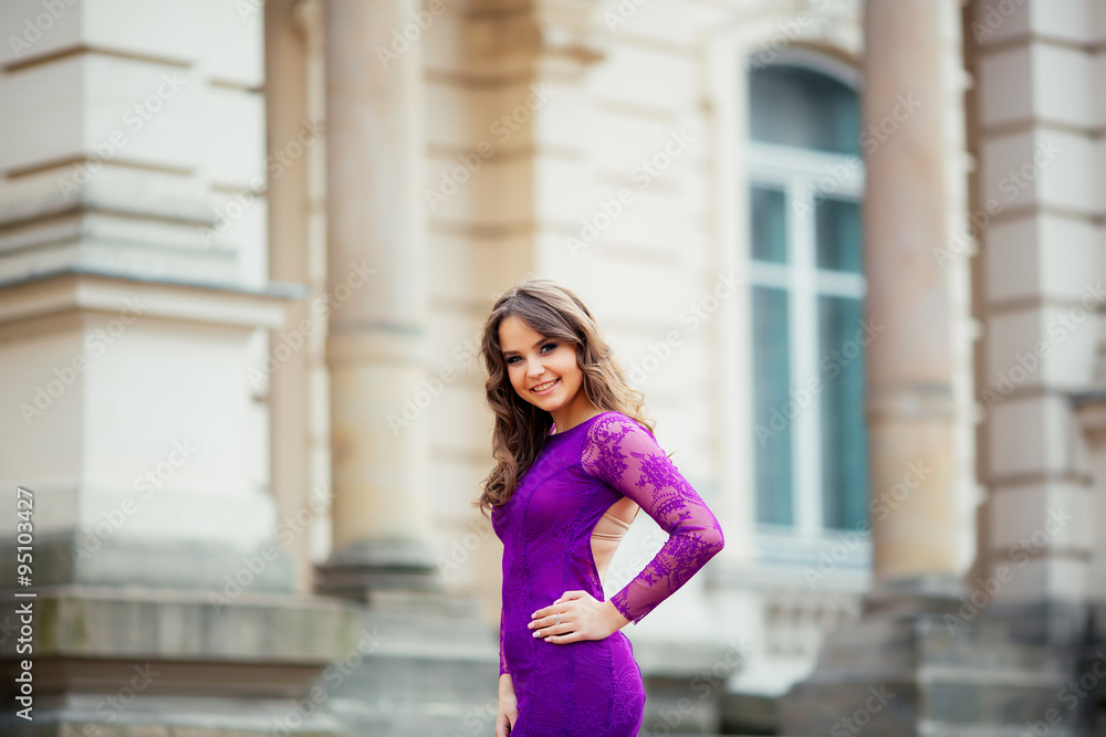 beautiful girl smiling in purple blue dress
