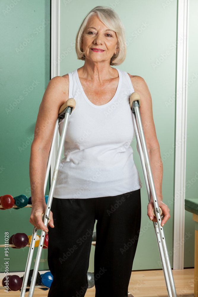 woman with a neck brace using crutches woman with a neck brace using crutches
