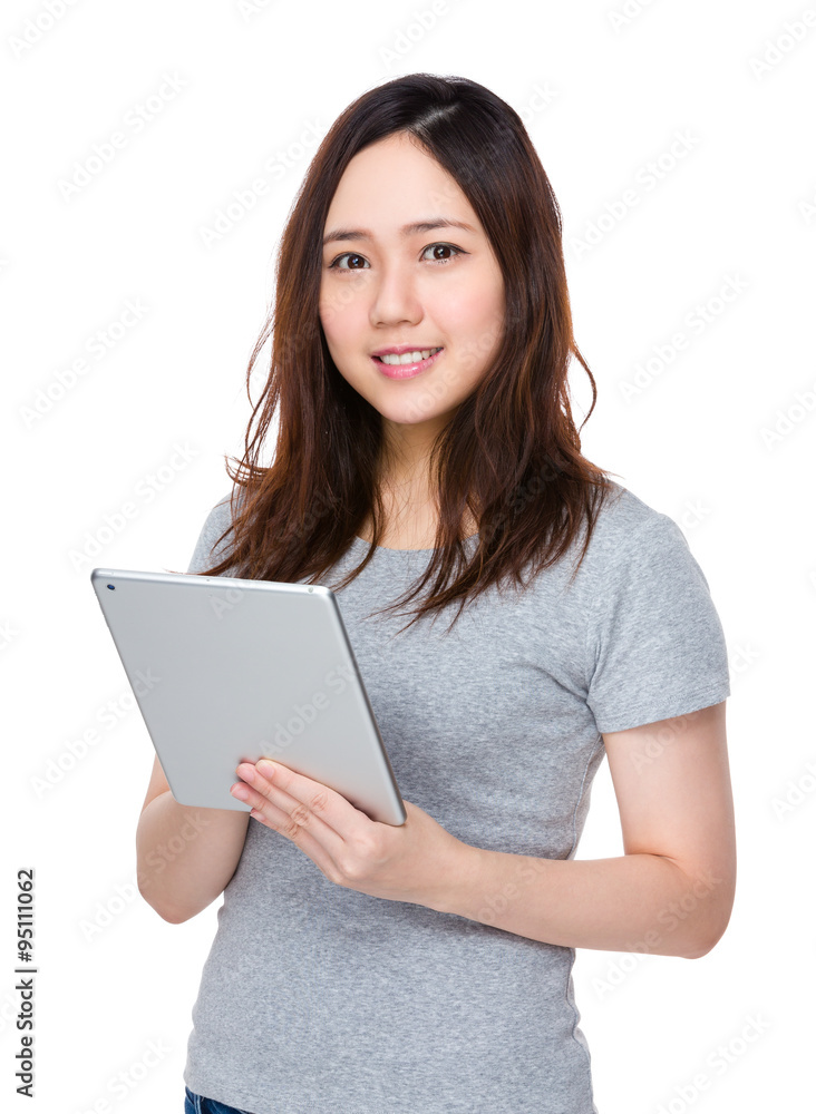 Asian Woman use of the tablet pc Asian Woman use of the tablet pc