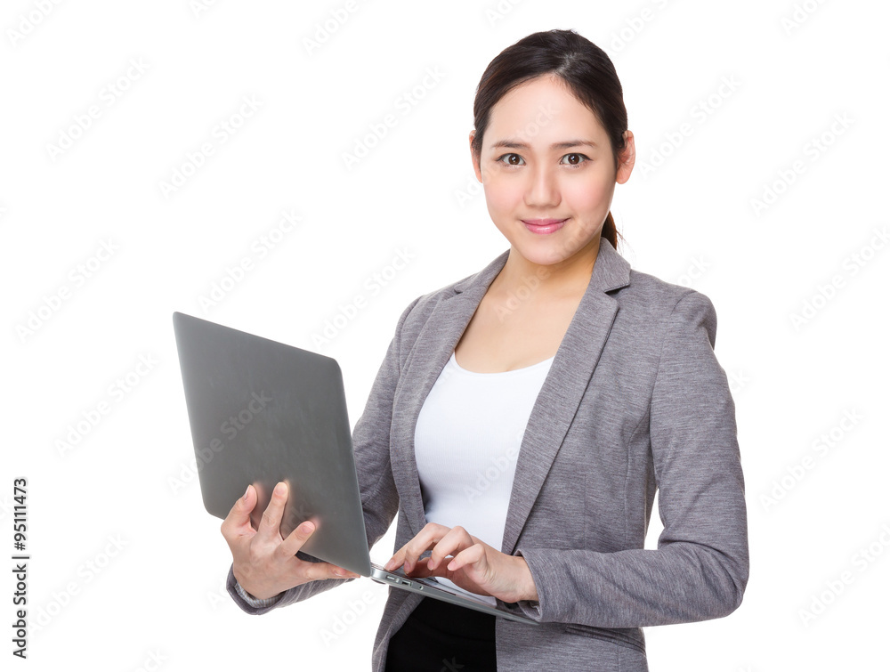 Asian Businesswoman use of the notebook computer Asian Businesswoman use of the notebook computer