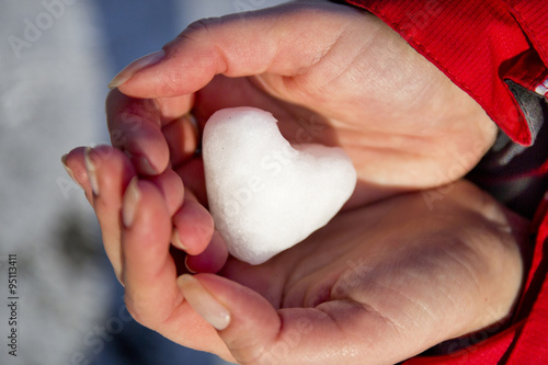 ice in the form of heart hands closeup