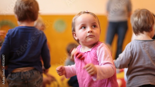 Cute baby girl with music instruments