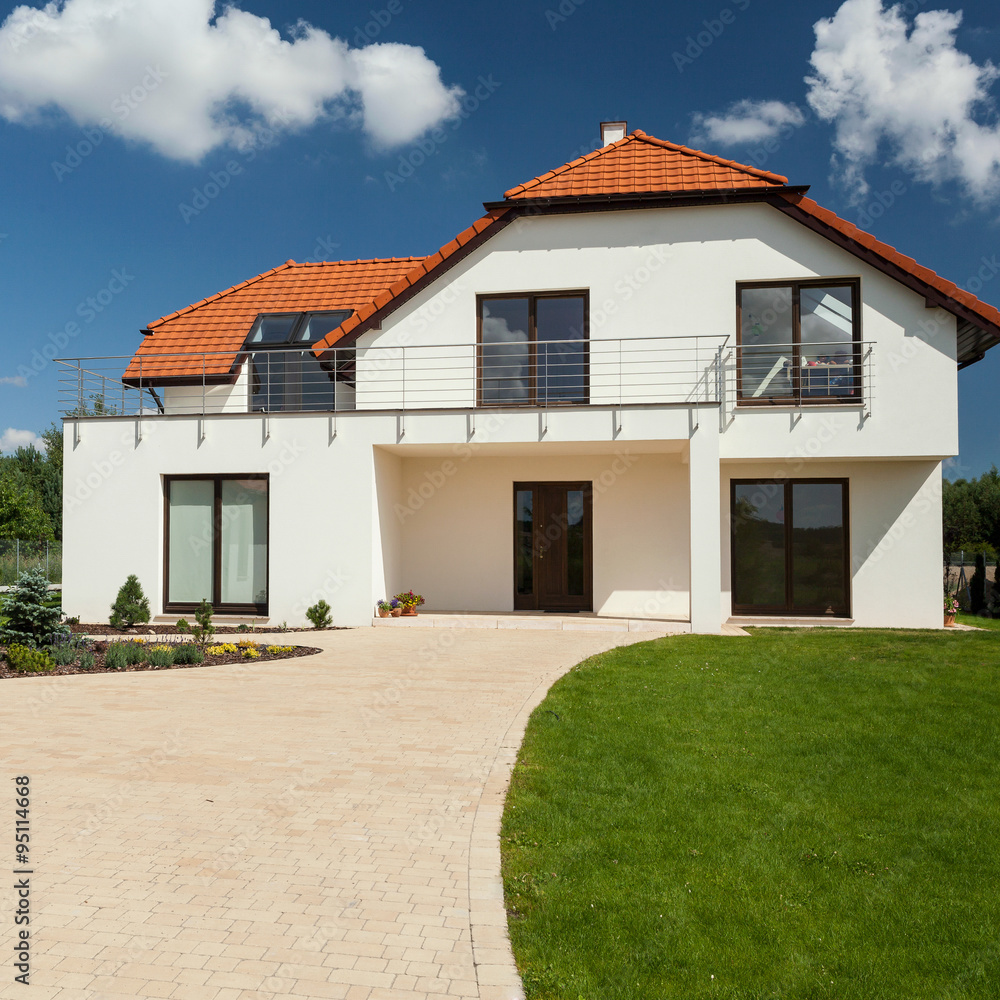 View of beautiful modern house with separate garage