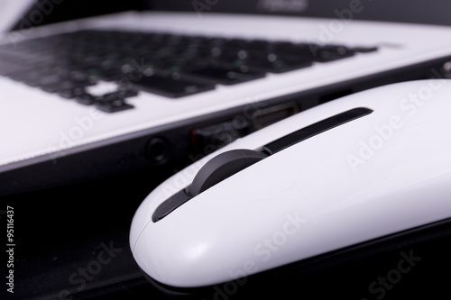 computer-white mouse with keyboard in the background