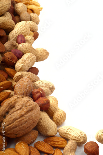 different kinds of nuts on a white background