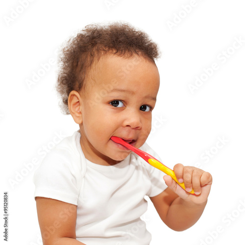 black baby brushing teeth.