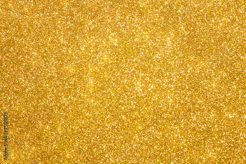 Fototapeta Golden glitter christmas abstract background. Shiny golden lights
